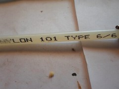 Unused: 3SX03-KL556 NYLON SPRING ROD,12-1/8 IN