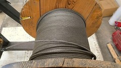 Portable Wire Rack Dispenser With 3 Rolls of wire as pictured