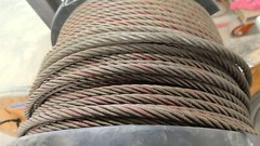 Portable Wire Rack Dispenser With 3 Rolls of wire as pictured
